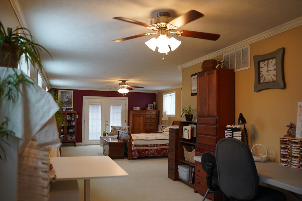 25065 Rock Springs Hollow Road Thebes, IL 62990 - Photo 38 of 50 a living room with furniture and a chandelier
