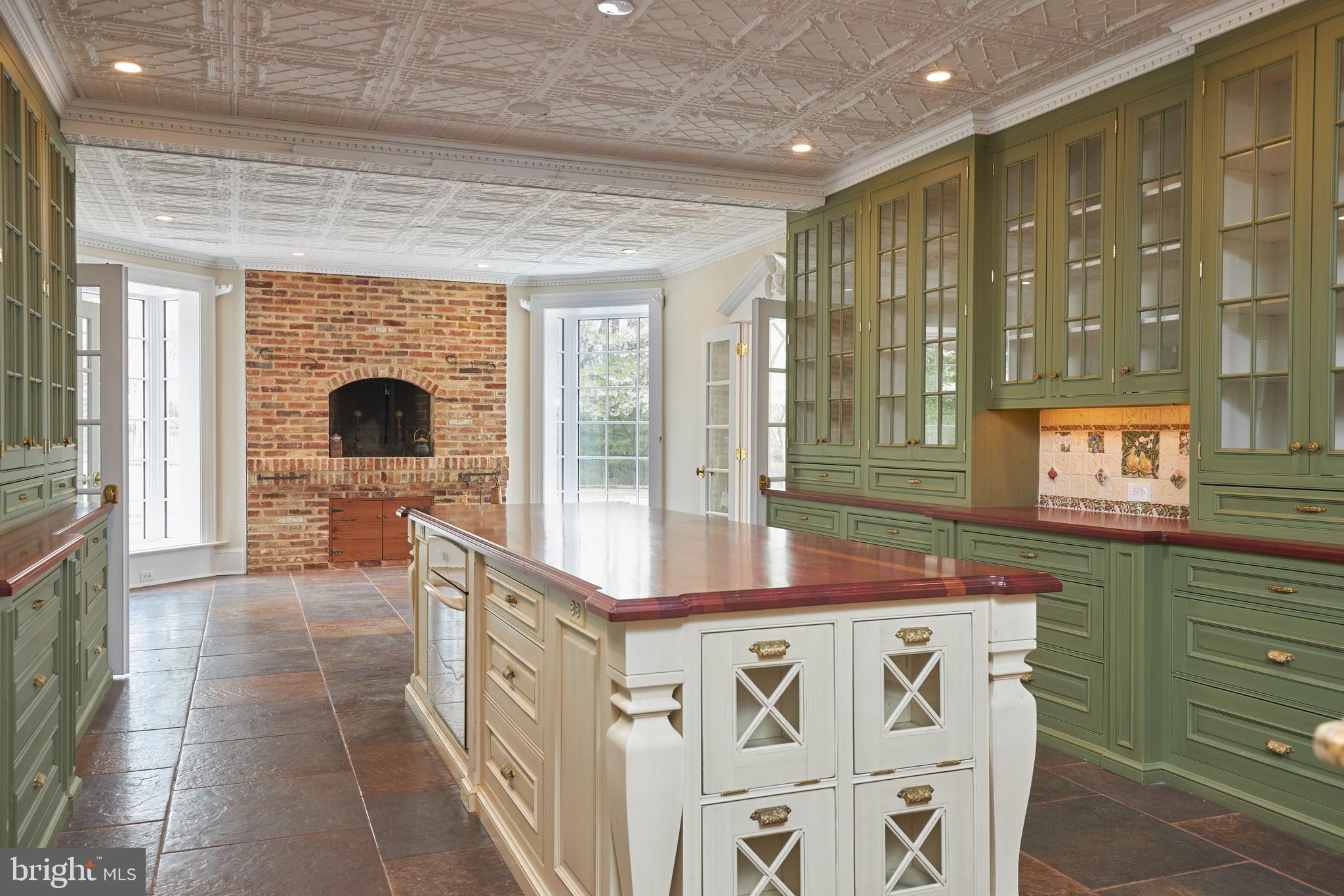 10304 Iron Gate Road Potomac, MD 20854 - Photo 18 of 39 Table Space at the End w/ Fireplace!