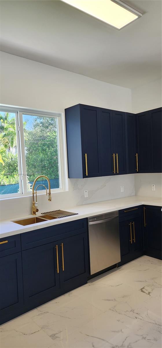 18961 Southwest 359th Street Homestead, FL 33034 - Photo 15 of 54 a kitchen with a sink and a large window