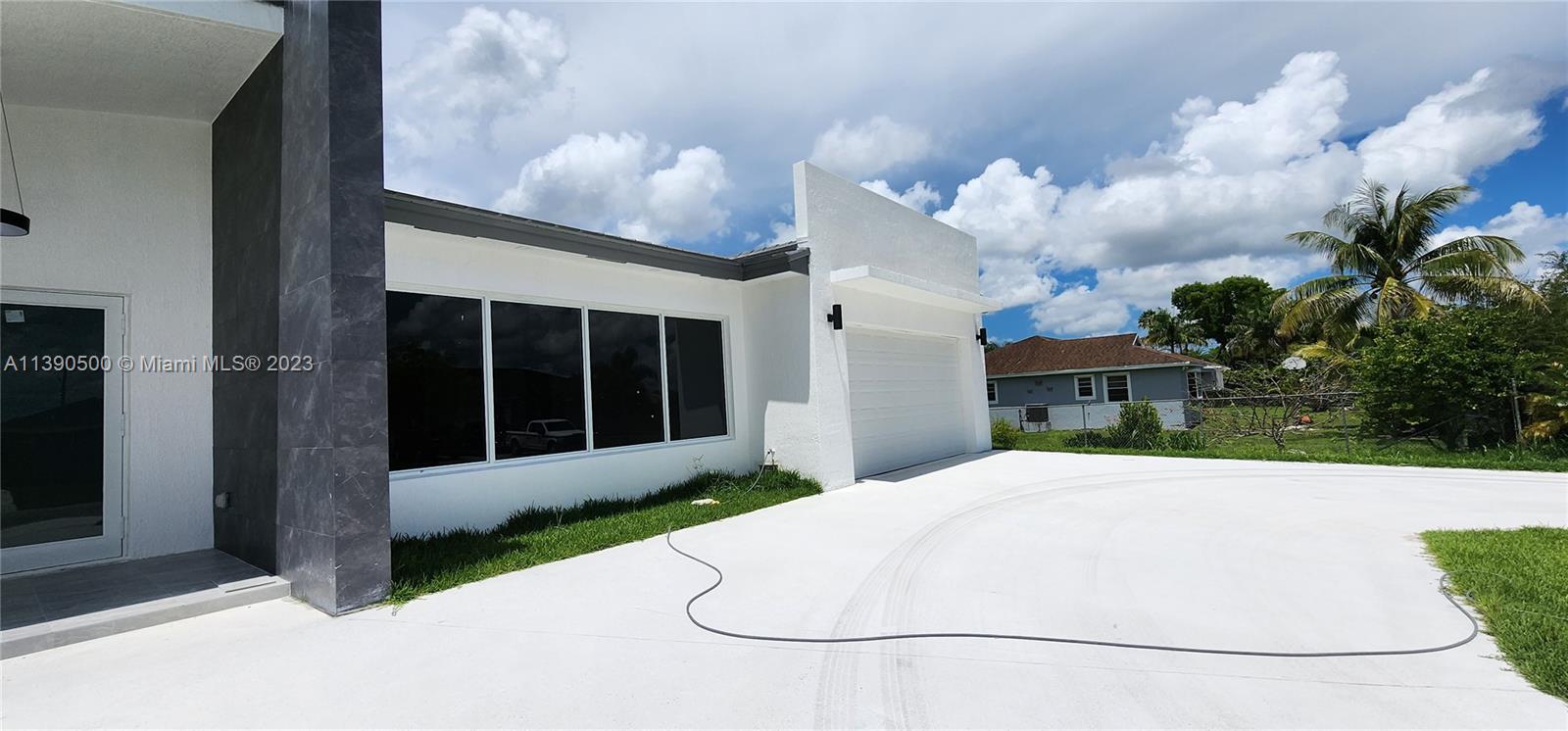 18961 Southwest 359th Street Homestead, FL 33034 - Photo 20 of 54 a house view with a garden space