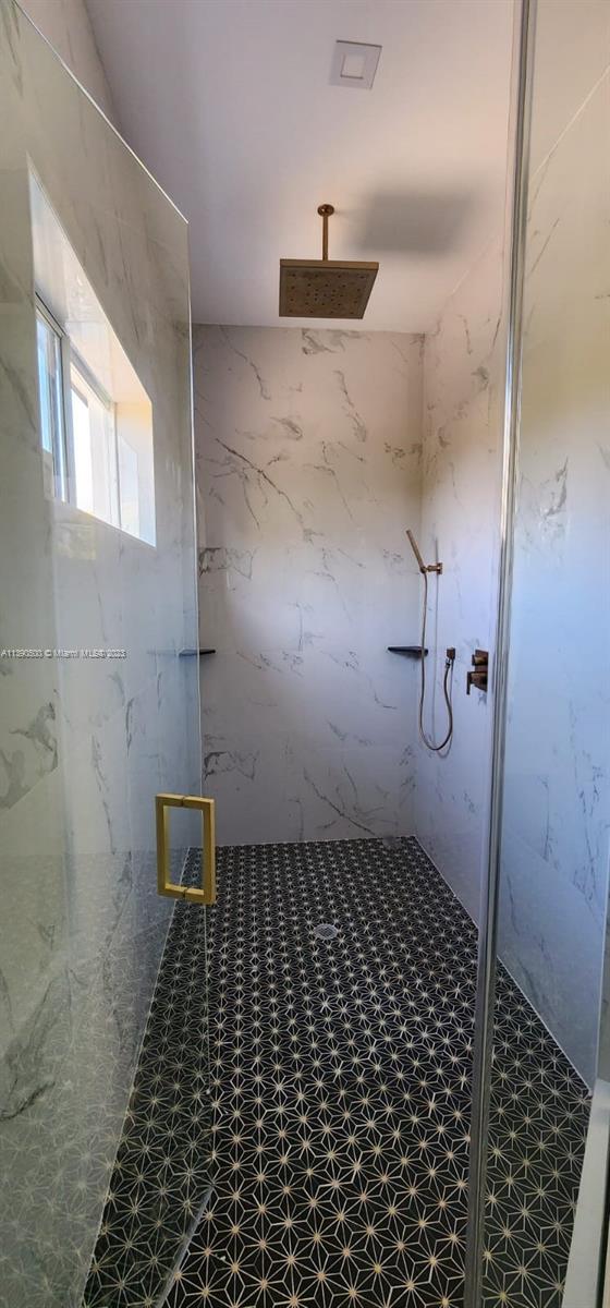 18961 Southwest 359th Street Homestead, FL 33034 - Photo 21 of 54 a bathroom with a sink and a shower