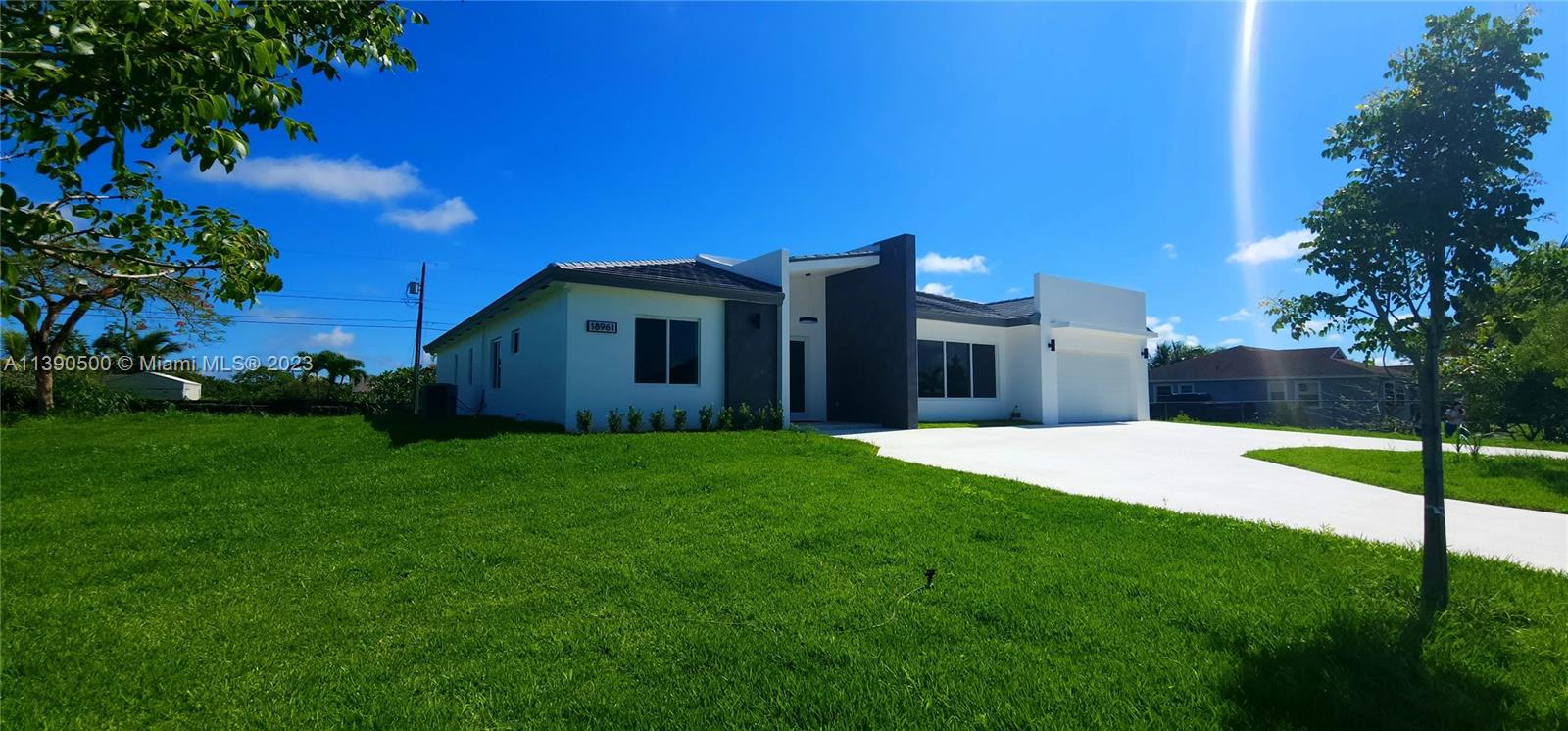 18961 Southwest 359th Street Homestead, FL 33034 - Photo 22 of 54 a front view of a house with a yard