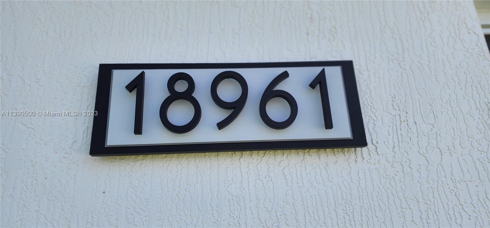18961 Southwest 359th Street Homestead, FL 33034 - Photo 31 of 54 a sign that is on a wooden wall