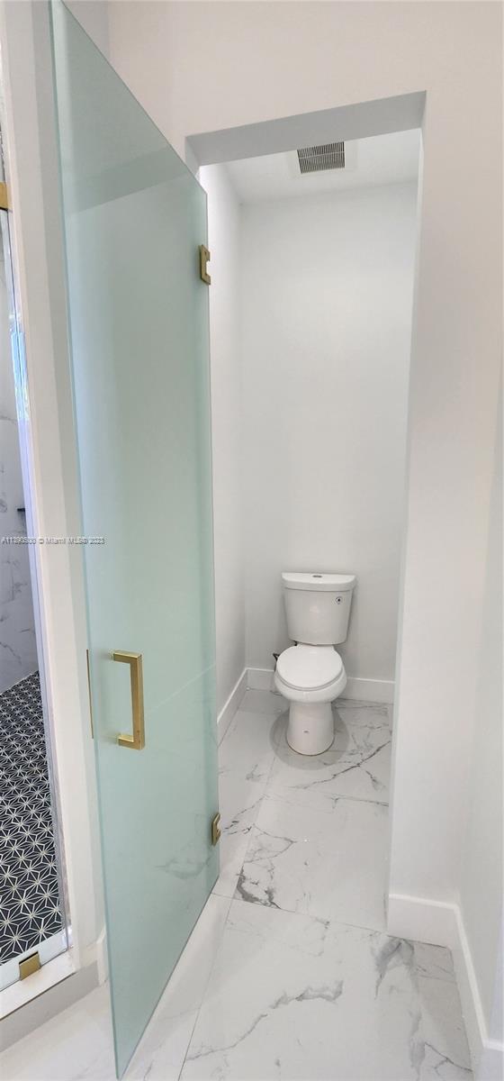 18961 Southwest 359th Street Homestead, FL 33034 - Photo 43 of 54 a bathroom with a toilet