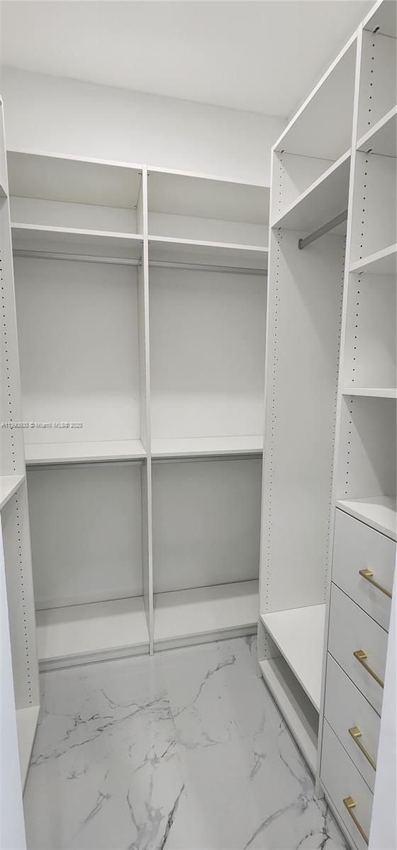 18961 Southwest 359th Street Homestead, FL 33034 - Photo 44 of 54 a view of an empty walk in closet