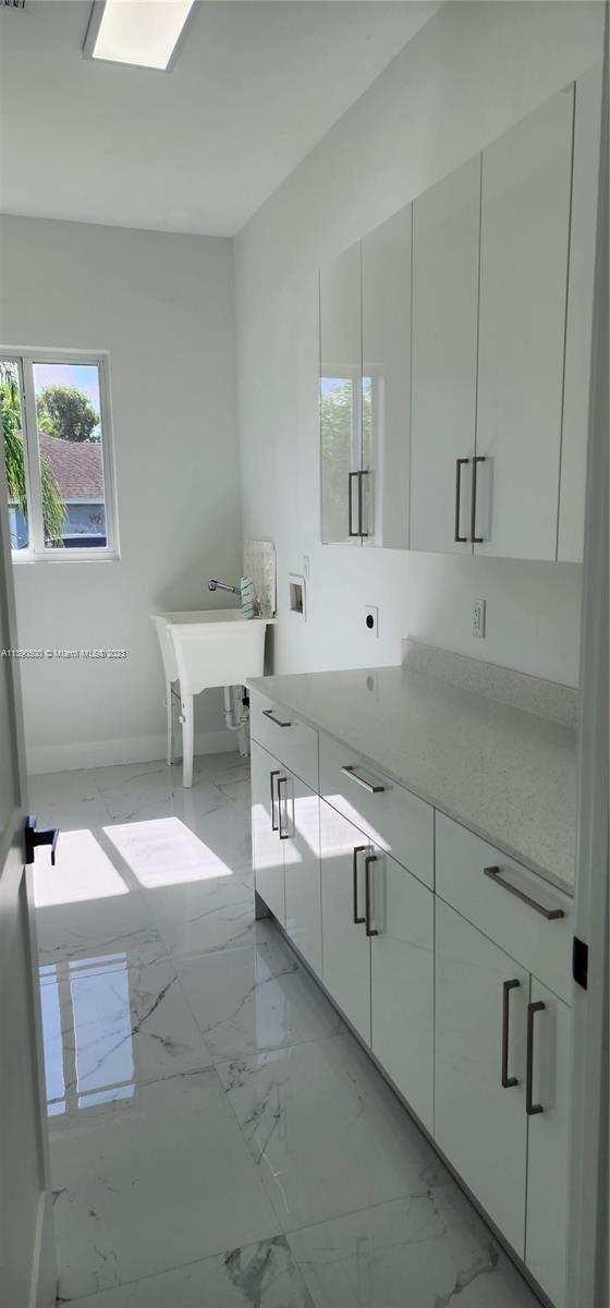 18961 Southwest 359th Street Homestead, FL 33034 - Photo 45 of 54 a bathroom with a sink and a mirror