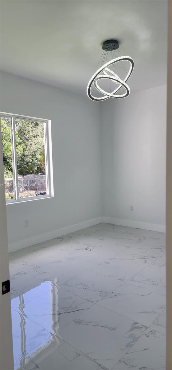 18961 Southwest 359th Street Homestead, FL 33034 - Photo 46 of 54 a view of room with window and ceiling fan