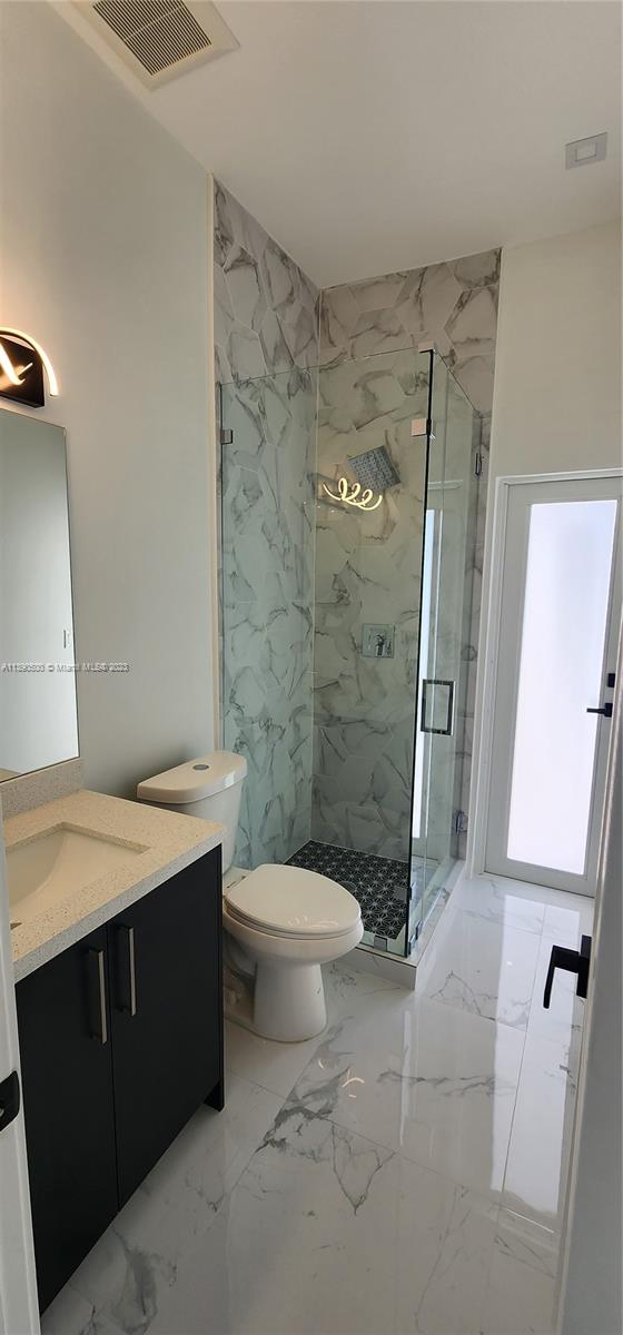 18961 Southwest 359th Street Homestead, FL 33034 - Photo 48 of 54 a bathroom with a sink a toilet and shower