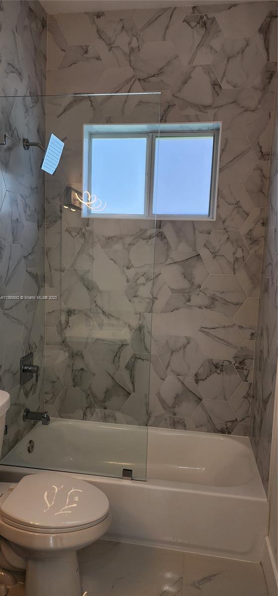 18961 Southwest 359th Street Homestead, FL 33034 - Photo 49 of 54 a bathroom with a toilet and a bathtub