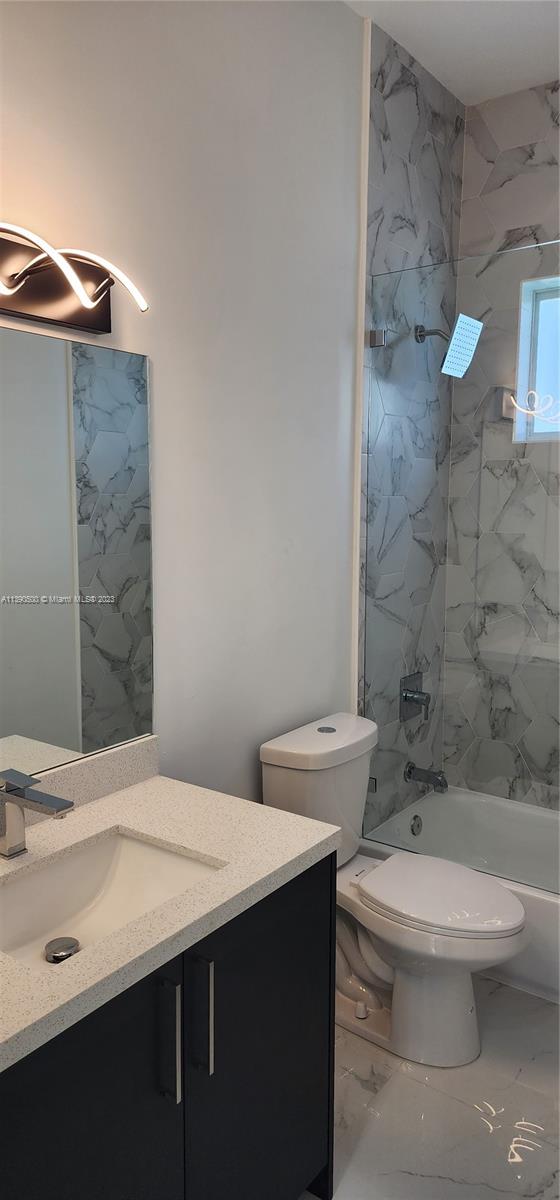 18961 Southwest 359th Street Homestead, FL 33034 - Photo 51 of 54 a bathroom with a sink a toilet and shower