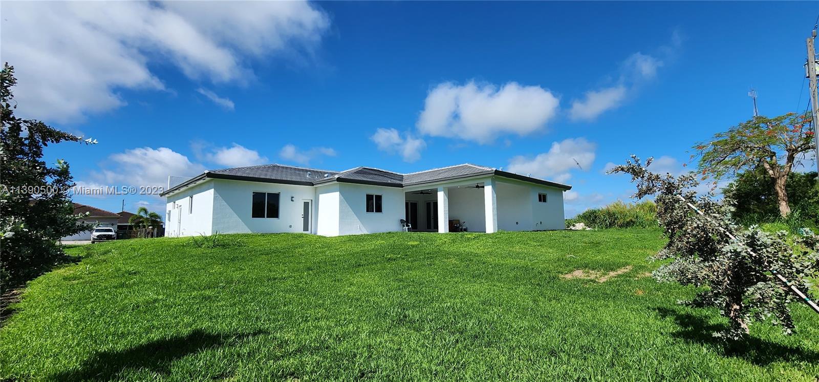 18961 Southwest 359th Street Homestead, FL 33034 - Photo 52 of 54 a front view of a house with a yard