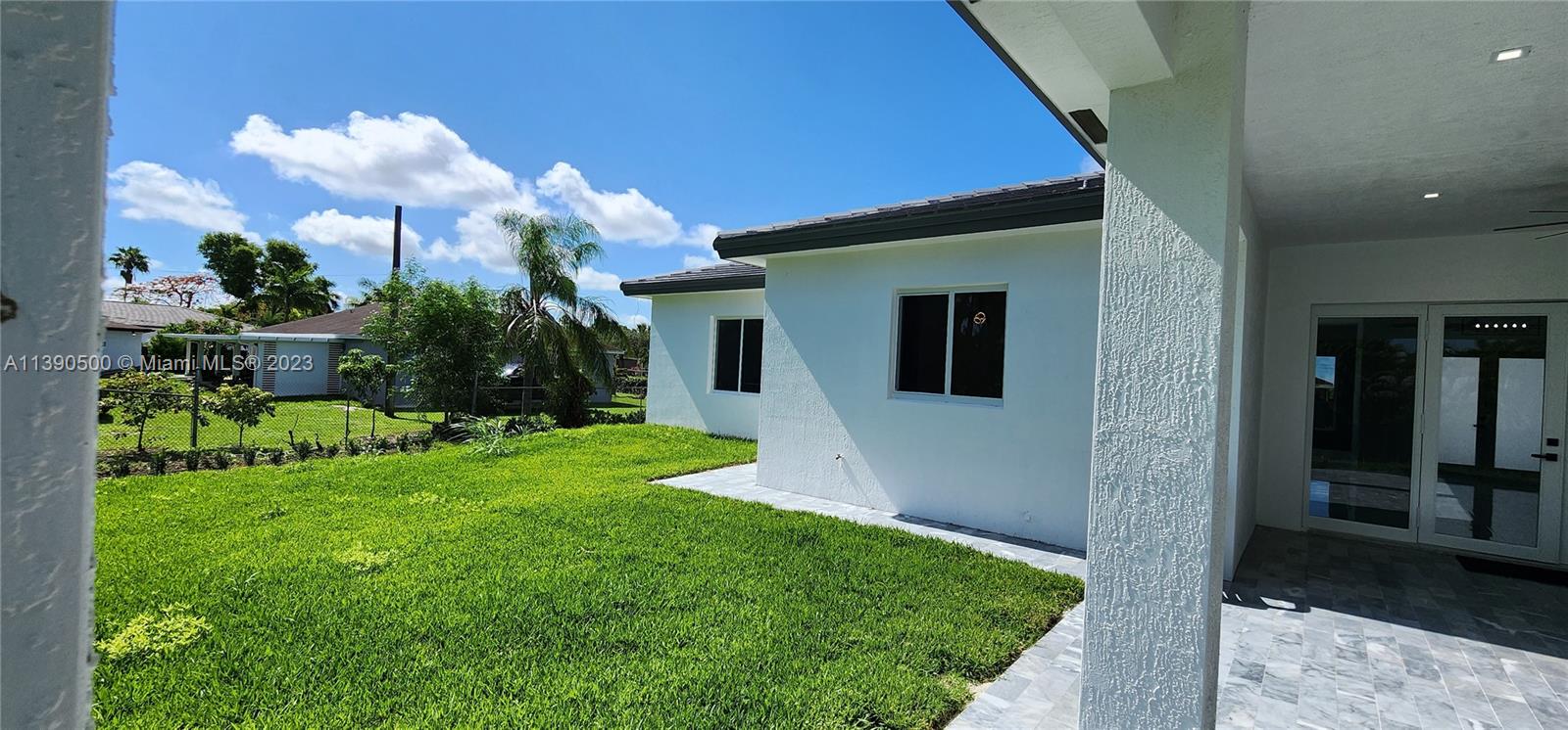 18961 Southwest 359th Street Homestead, FL 33034 - Photo 54 of 54 a view of a house with a backyard