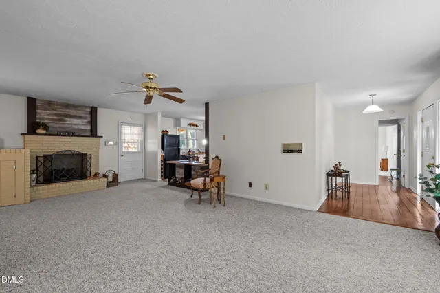 a kitchen with stainless steel appliances granite countertop white cabinets and window