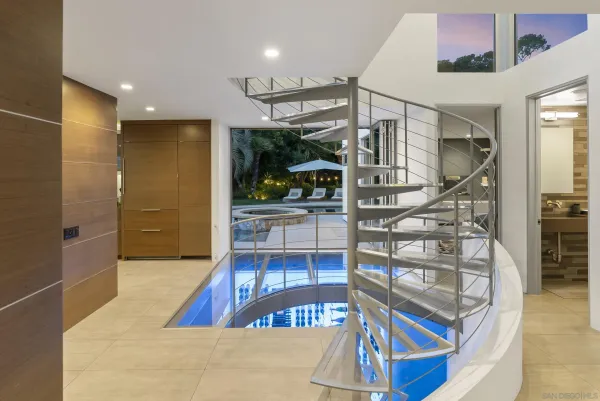 a view of a swimming pool with outdoor seating