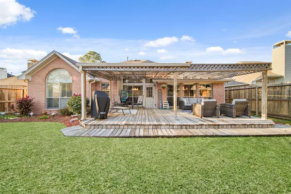 a front view of a house with a yard table and chairs