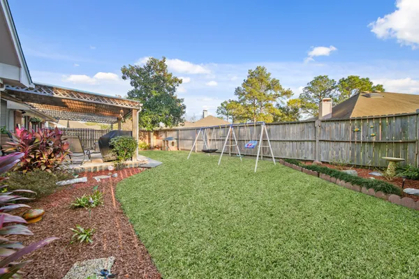 a view of a backyard with sitting area