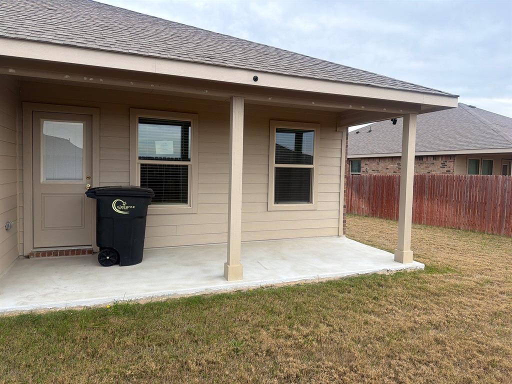 721 Durango Lane Cleburne, TX 76033 - Photo 24 of 25 a view of a front door and outdoor space