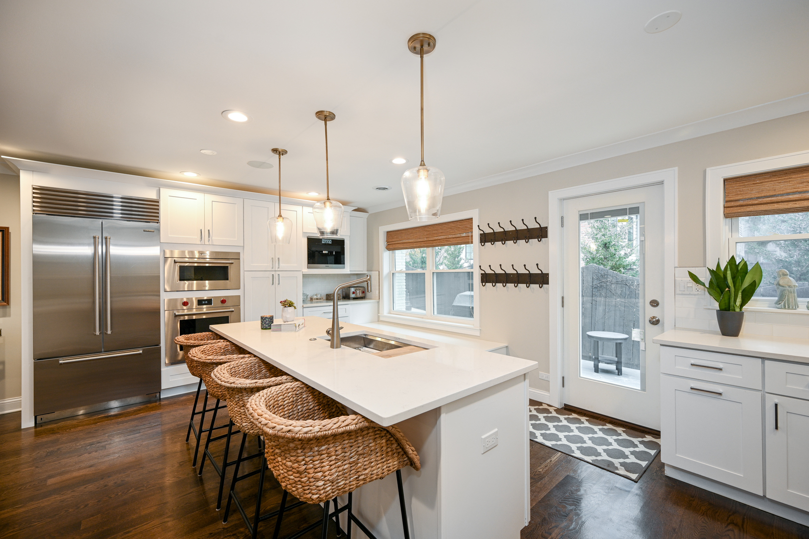 530 Anthony Street, Unit 530 Glen Ellyn, IL 60137 - Photo 8 of 25 a kitchen with refrigerator cabinets and wooden floor