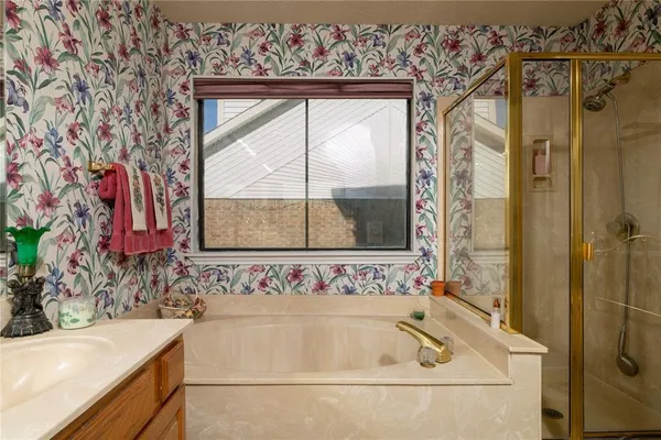 a bathroom with a bathtub and a sink