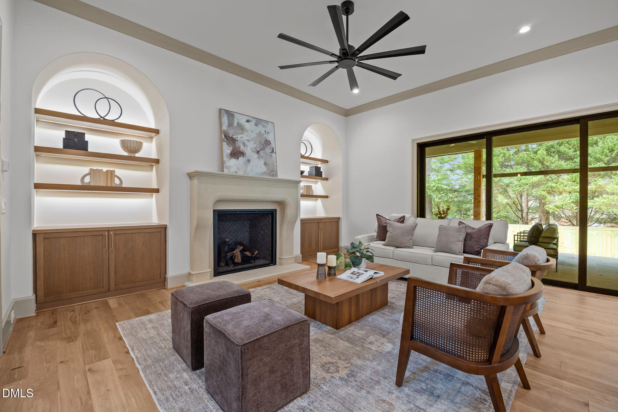 1116 Kimberly Drive Raleigh, NC 27609 - Photo 9 of 71 a living room with furniture a fireplace and a floor to ceiling window