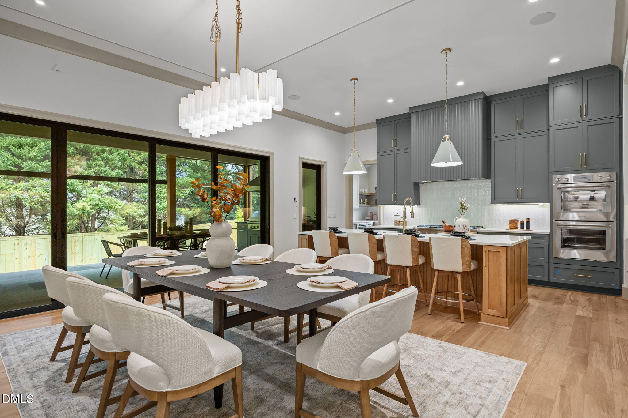 1116 Kimberly Drive Raleigh, NC 27609 - Photo 12 of 71 a view of a dining room with furniture wooden floor and chandelier