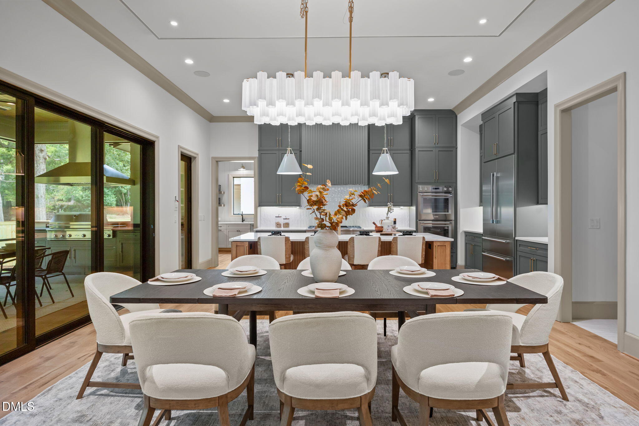1116 Kimberly Drive Raleigh, NC 27609 - Photo 17 of 71 a view of a dining room with furniture large windows and wooden floor
