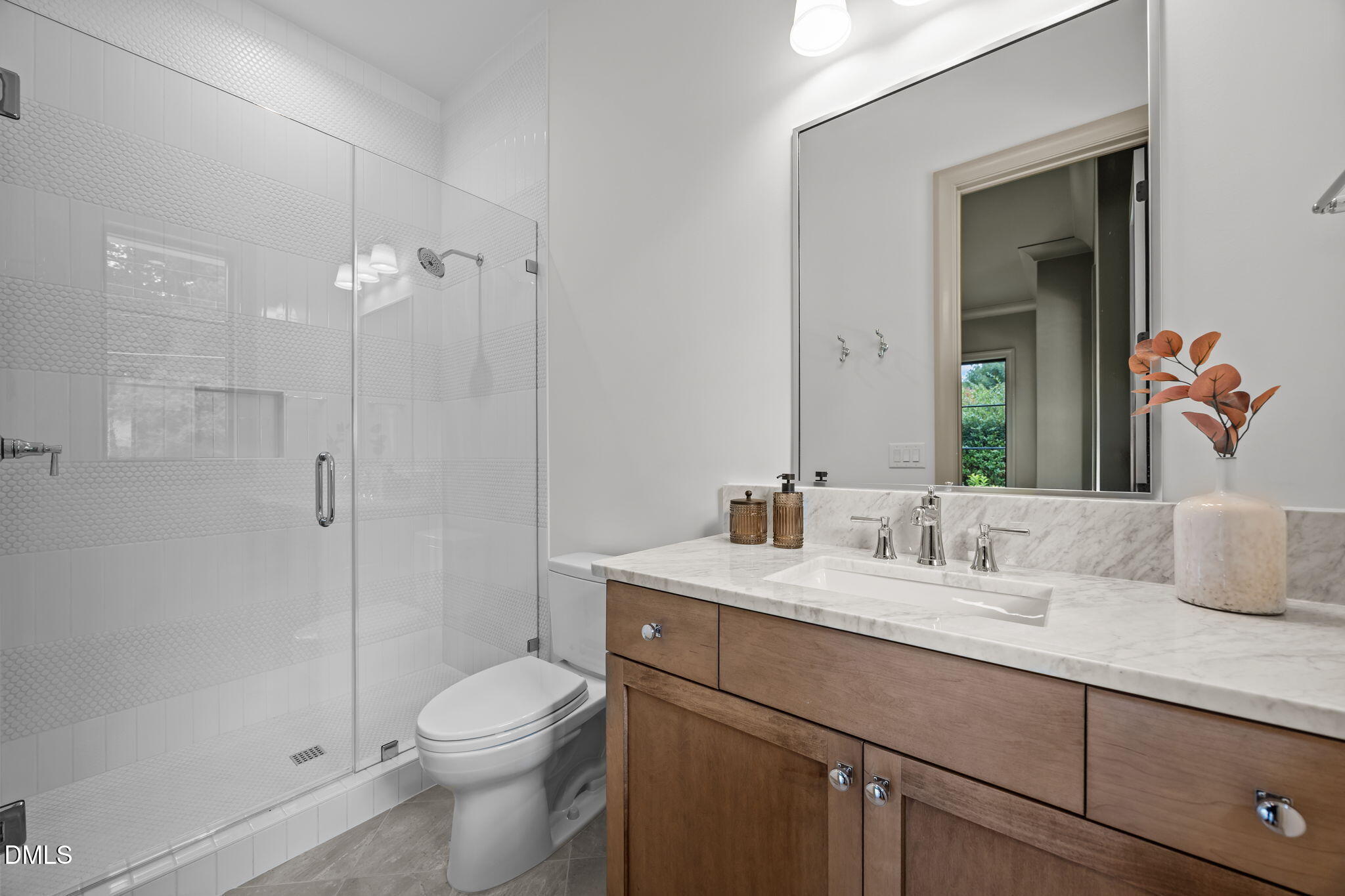 1116 Kimberly Drive Raleigh, NC 27609 - Photo 31 of 71 a bathroom with a sink a toilet and shower