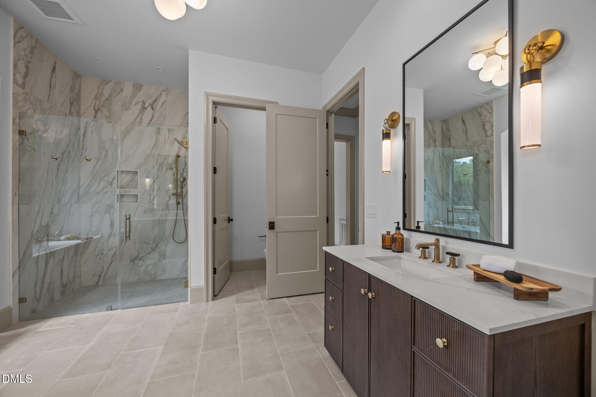 1116 Kimberly Drive Raleigh, NC 27609 - Photo 37 of 71 a bathroom with a double vanity sink mirror double and shower