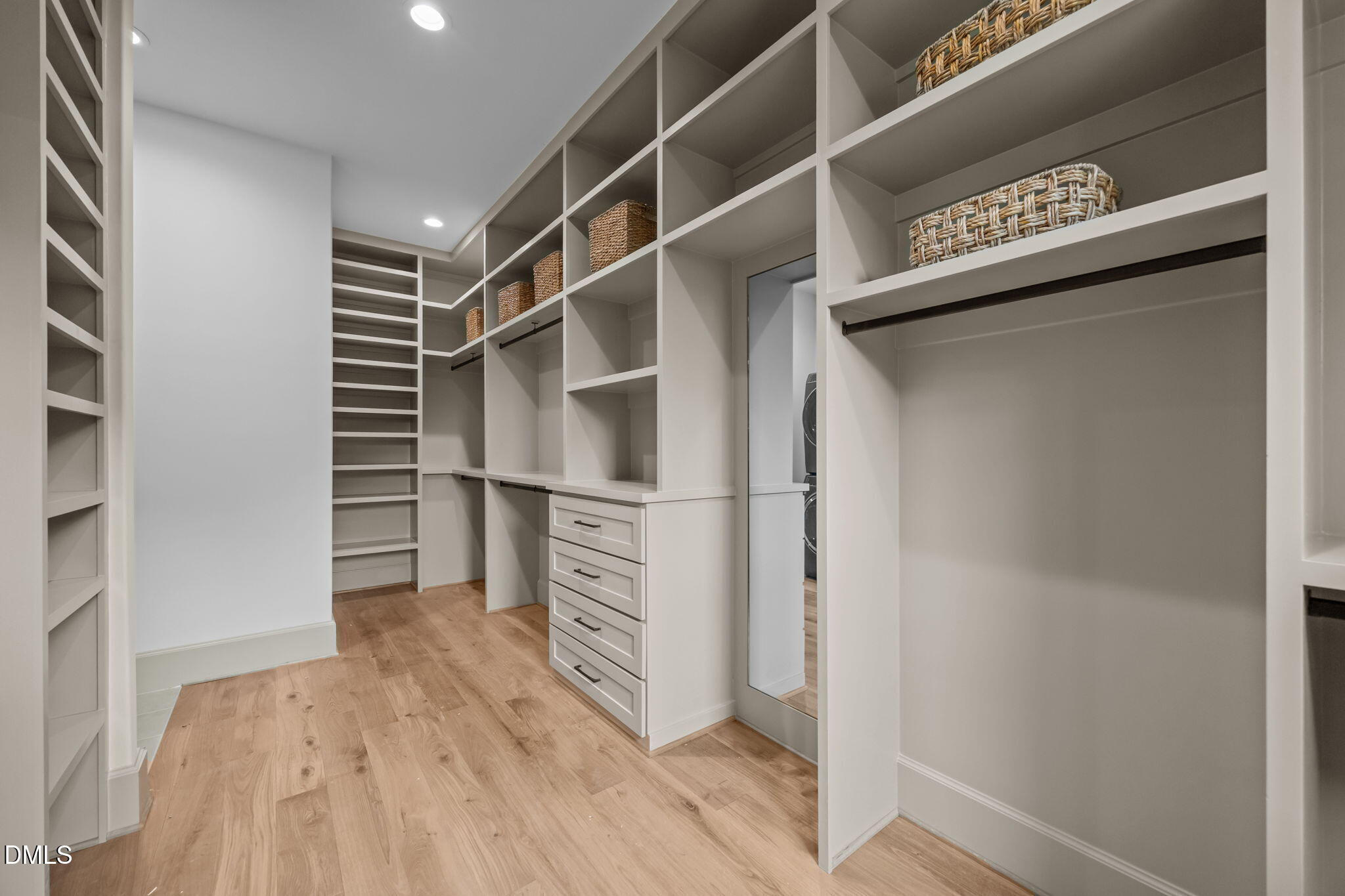 1116 Kimberly Drive Raleigh, NC 27609 - Photo 40 of 71 a view of walk in closet with empty racks