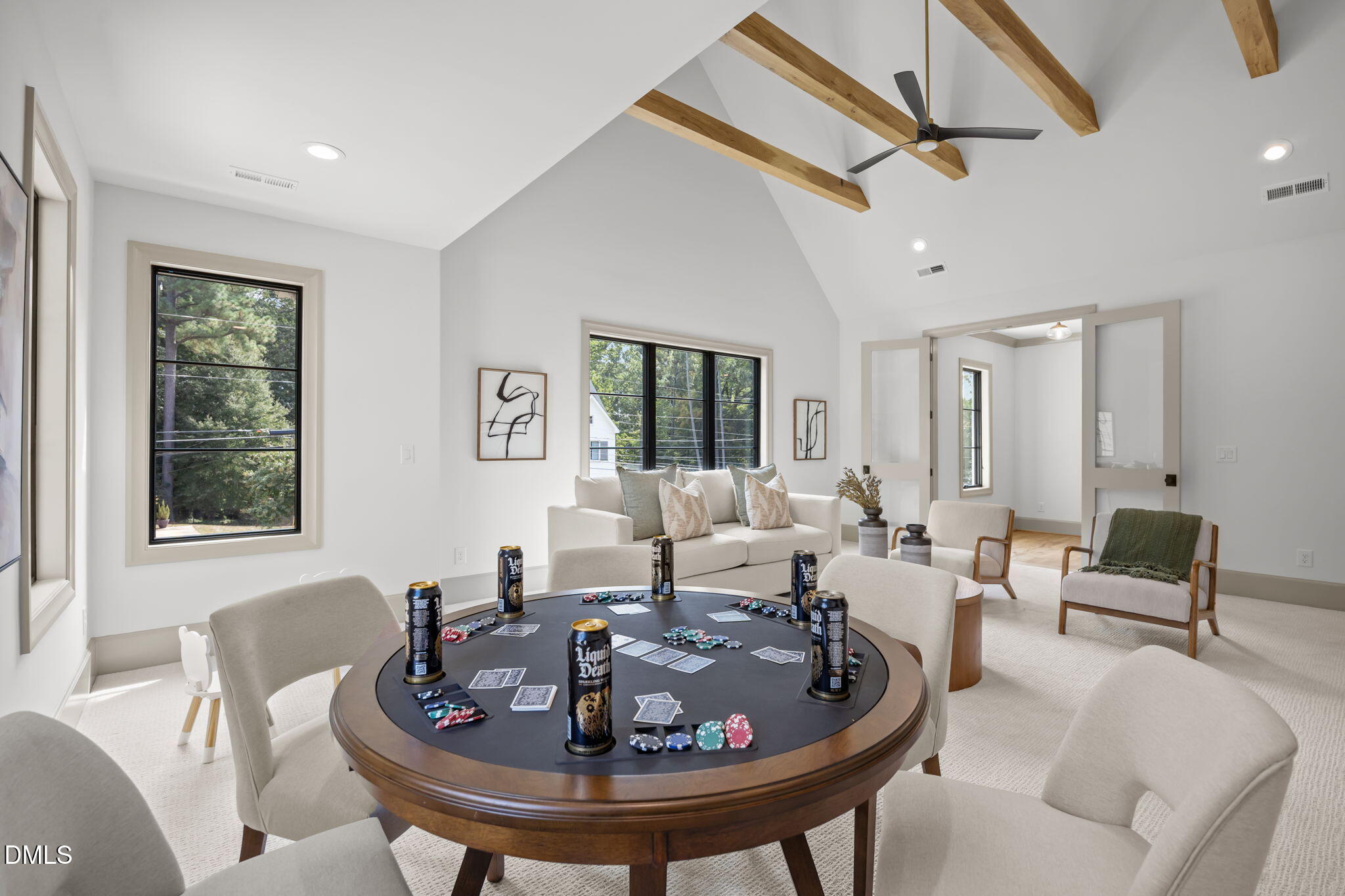 1116 Kimberly Drive Raleigh, NC 27609 - Photo 43 of 71 a living room with furniture a window and a chandelier