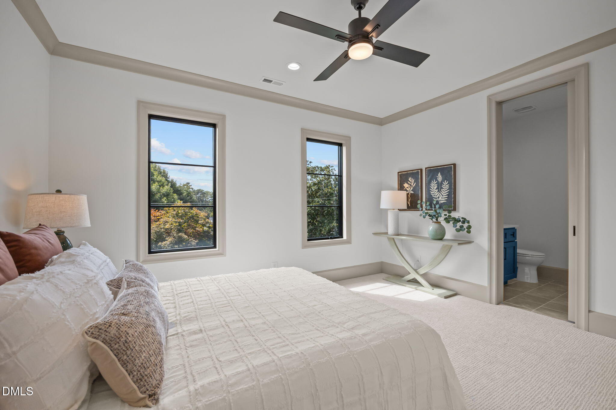 1116 Kimberly Drive Raleigh, NC 27609 - Photo 53 of 71 a bedroom with a large bed and a window