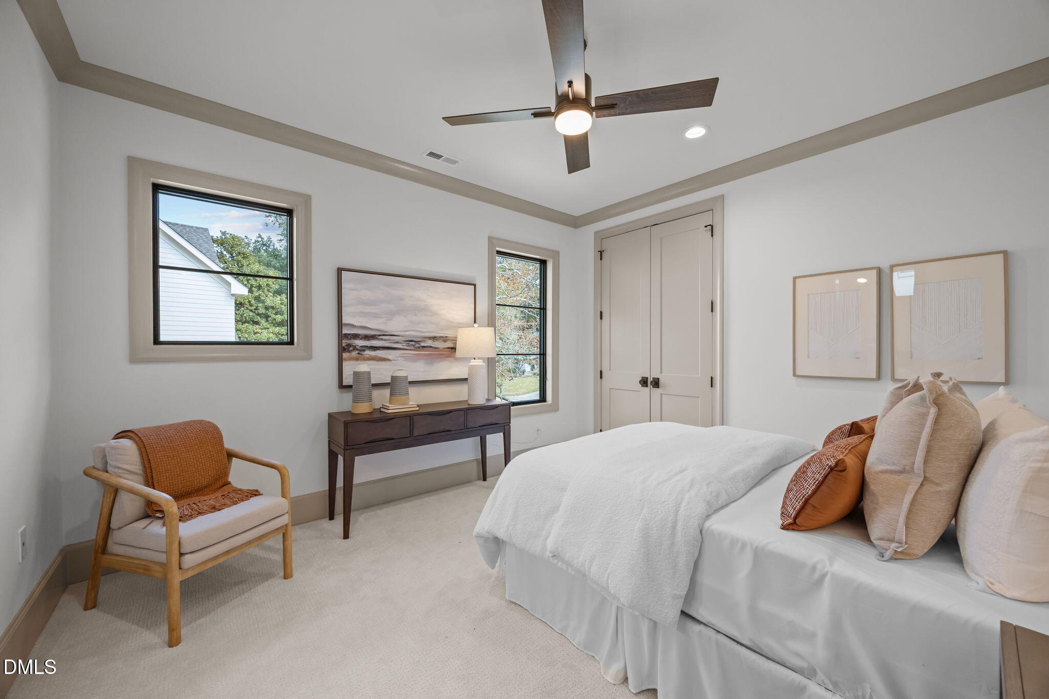 1116 Kimberly Drive Raleigh, NC 27609 - Photo 58 of 71 a bedroom with a bed and a chair