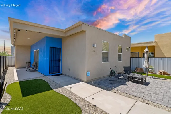 a view of backyard with patio