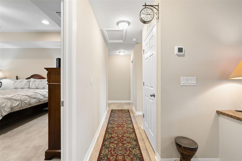 31046 Parrot Reef Court Wesley Chapel, FL 33545 - Photo 33 of 99 a en suite bathroom with a granite countertop sink and a mirror