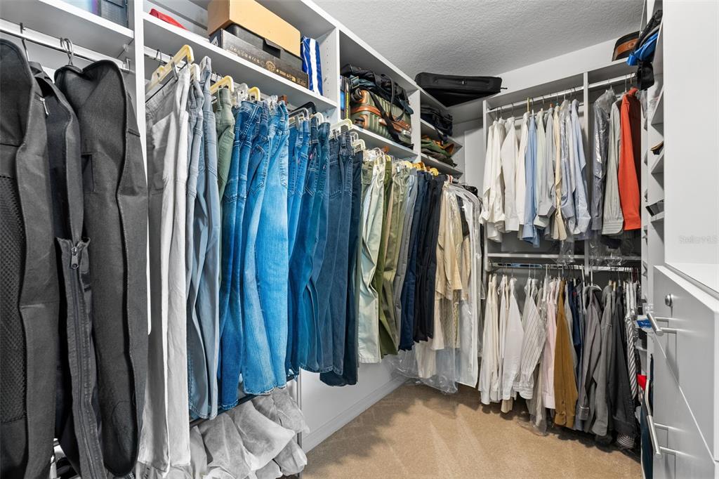31046 Parrot Reef Court Wesley Chapel, FL 33545 - Photo 42 of 99 a view of walk in closet with clothes