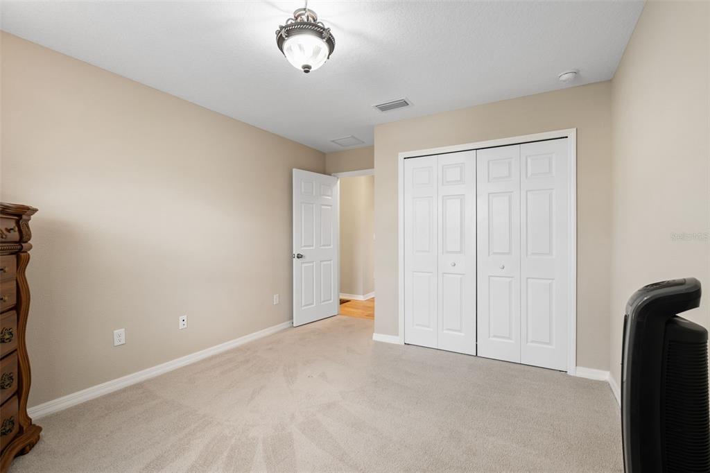 31046 Parrot Reef Court Wesley Chapel, FL 33545 - Photo 50 of 99 a view of an empty room