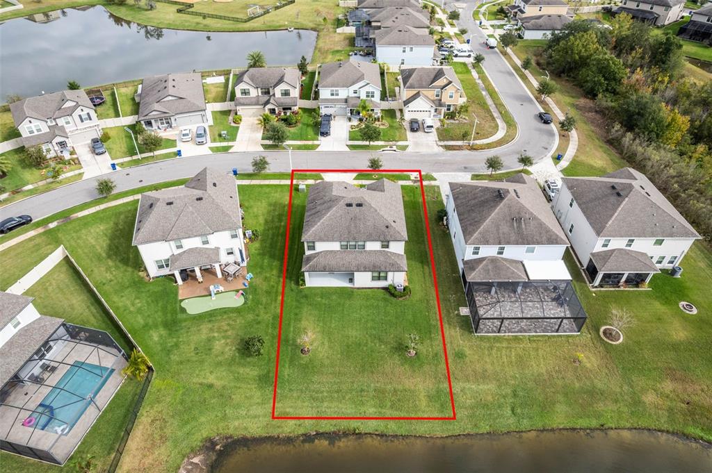 31046 Parrot Reef Court Wesley Chapel, FL 33545 - Photo 59 of 99 an aerial view of a residential houses with outdoor space