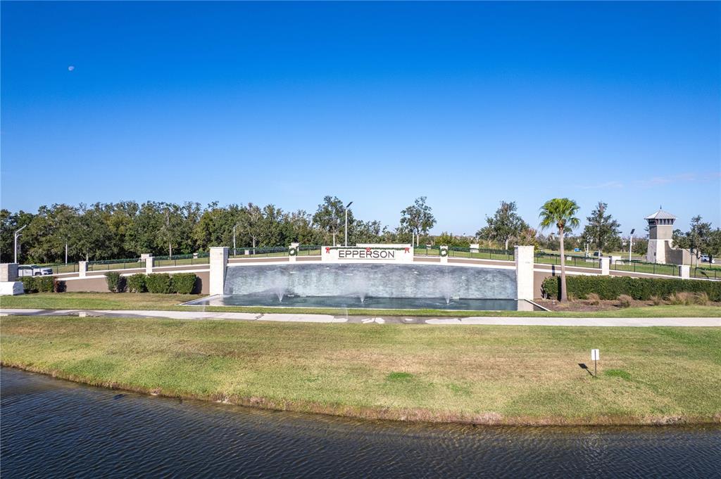 31046 Parrot Reef Court Wesley Chapel, FL 33545 - Photo 61 of 99 a view of a swimming pool with an ocean view