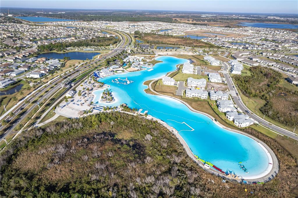 31046 Parrot Reef Court Wesley Chapel, FL 33545 - Photo 63 of 99 an aerial view of a house with a ocean beach