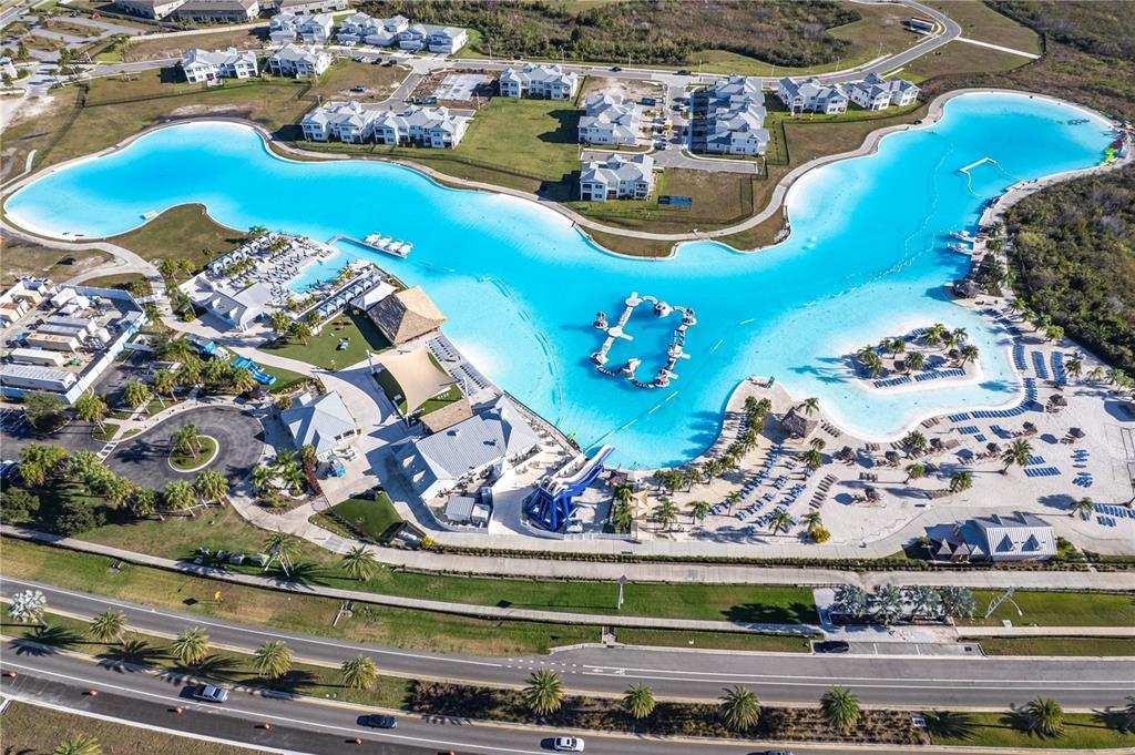 31046 Parrot Reef Court Wesley Chapel, FL 33545 - Photo 65 of 99 an aerial view of a house with a swimming pool yard and outdoor seating