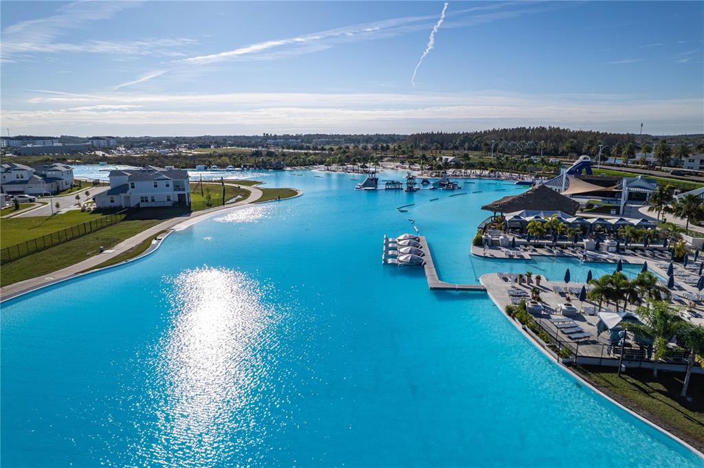31046 Parrot Reef Court Wesley Chapel, FL 33545 - Photo 71 of 99 an aerial view of a city with lots of residential buildings ocean and mountain view in back