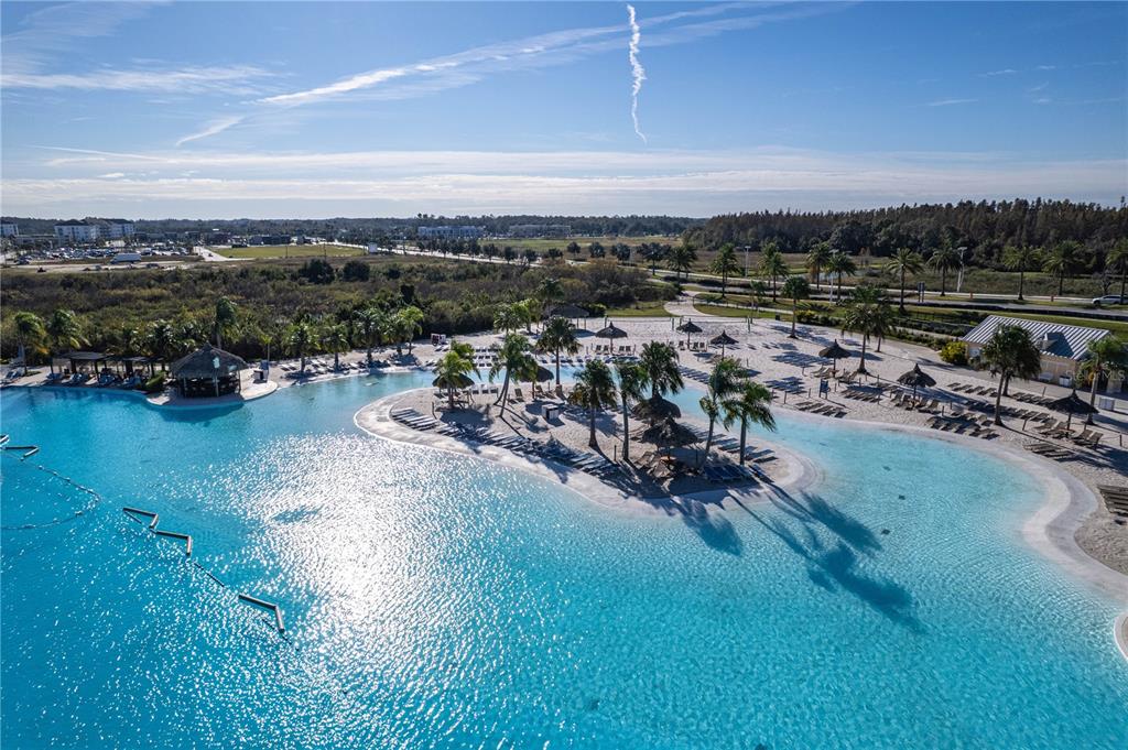 31046 Parrot Reef Court Wesley Chapel, FL 33545 - Photo 72 of 99 an aerial view of a city with lots of residential buildings ocean and mountain view in back