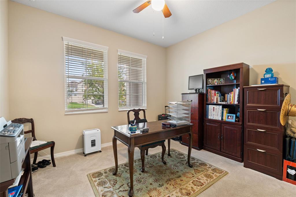 31046 Parrot Reef Court Wesley Chapel, FL 33545 - Photo 10 of 99 a living room with furniture and wooden floor