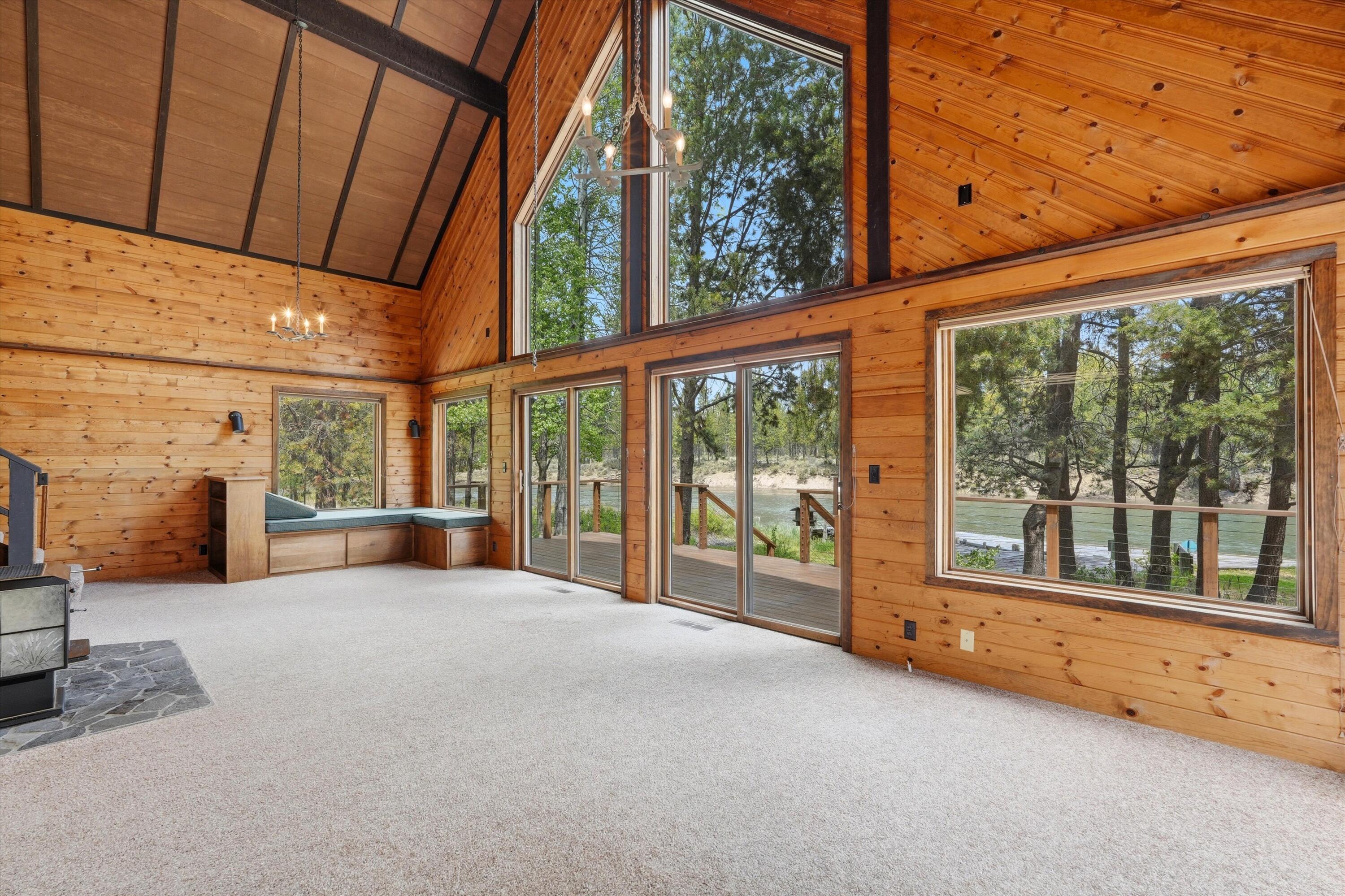 56446 Eclipse Drive Bend, OR 97707 - Photo 21 of 42 a view of an empty room with a fireplace and a window