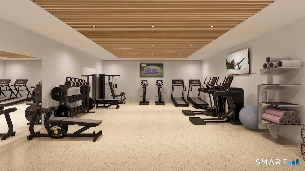 2 Arapahoe Road, Unit 410 West Hartford, CT 06107 - Photo 9 of 29 a view of a room with gym equipment