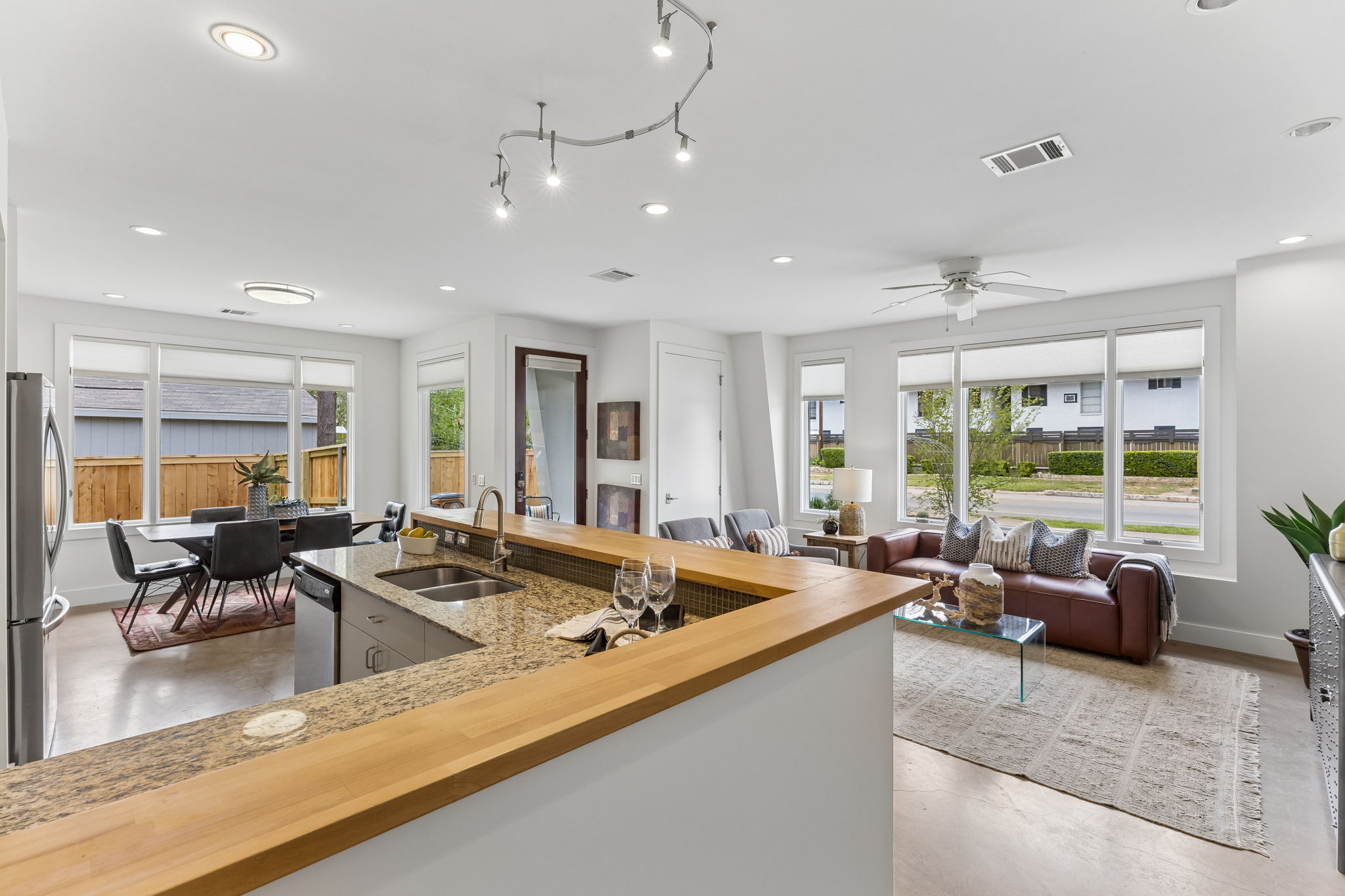5305 Guadalupe Street, Unit A Austin, TX 78751 - Photo 3 of 31 Kitchen featuring butcher block breakfast bar, recessed lighting, stainless steel appliances, and plenty of natural light