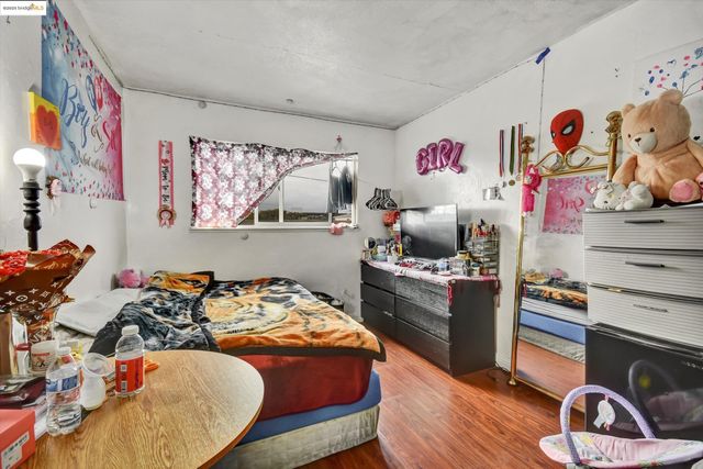 a bedroom with a bed and furniture