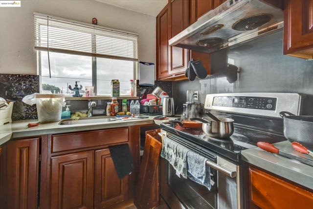 a kitchen with a stove and a sink