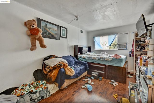 a bedroom with a bed and cabinets