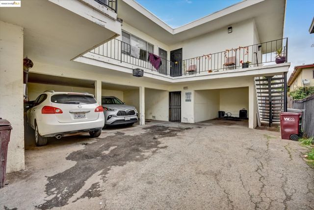 a view of a car park in front of house